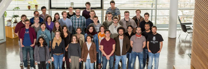 Group photo of 35 PhD students inside the institute.